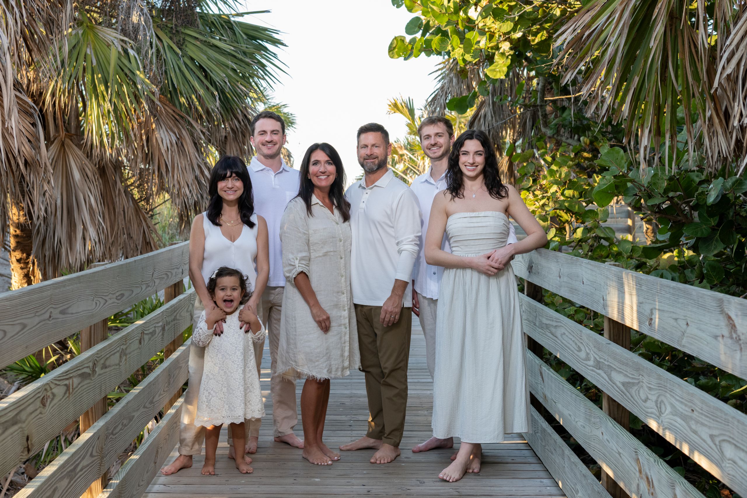 multigenerational family together on a boardwalk by Venice Beach
