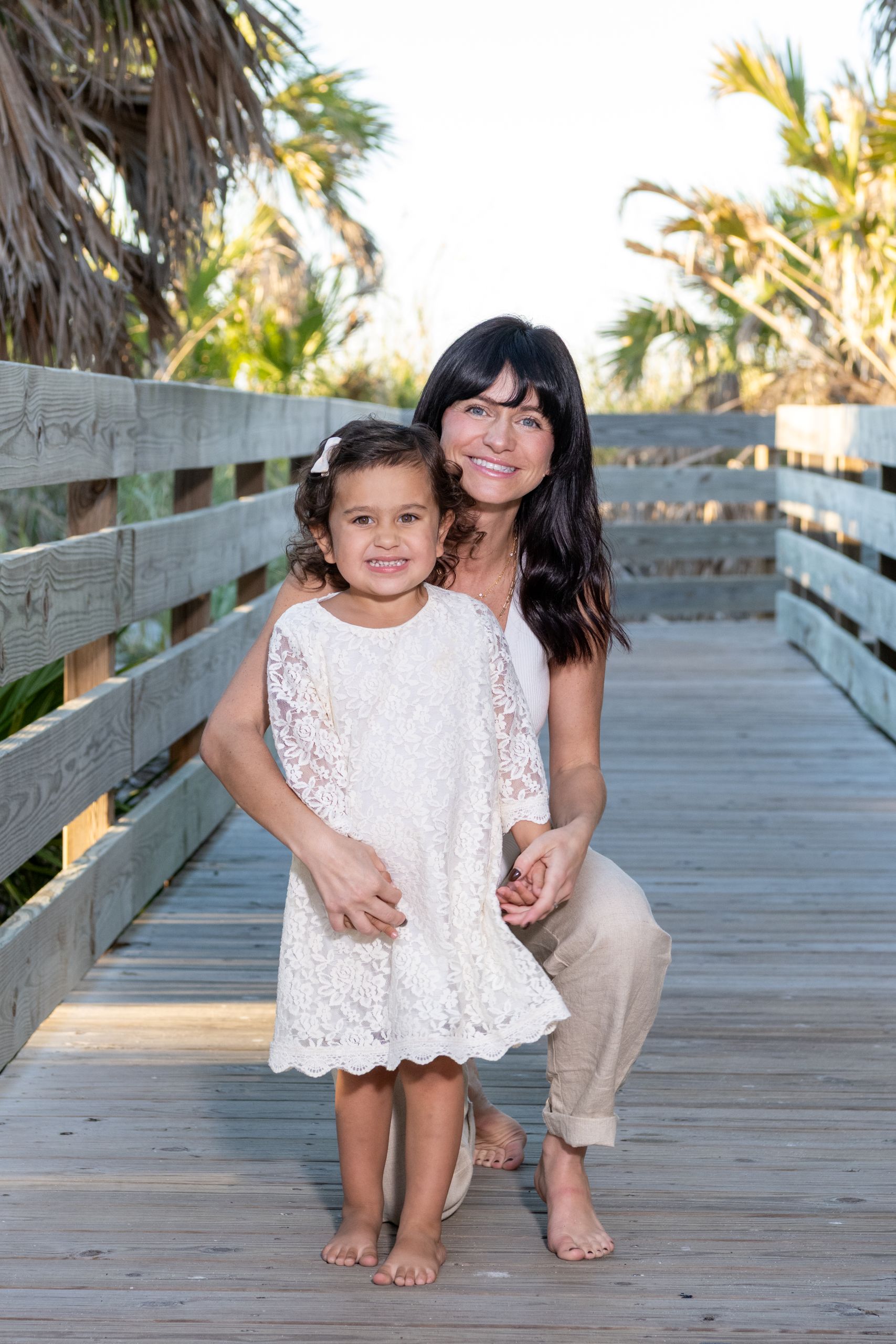 mom with her daughter on the boardwalk