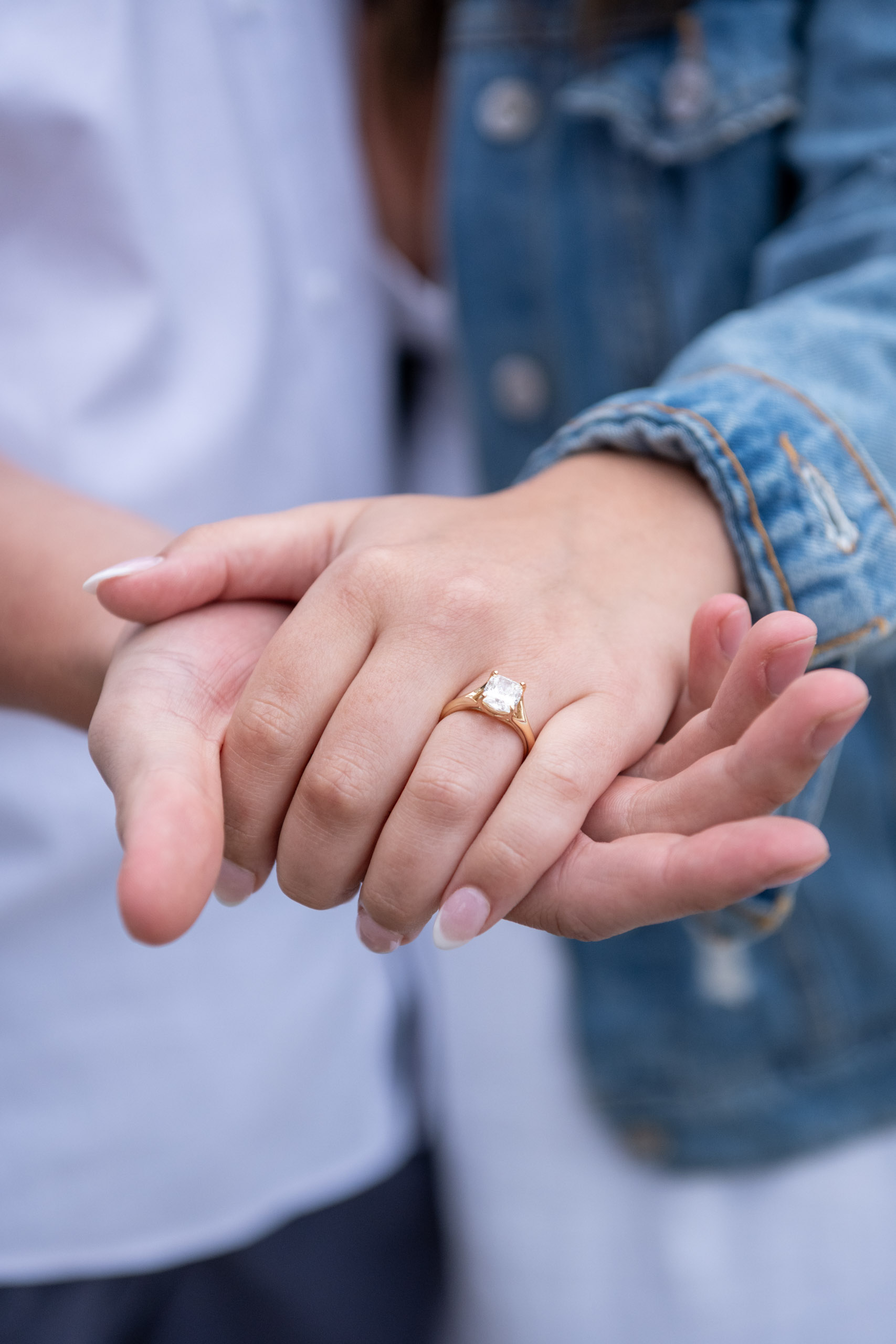 woman shows off her engagement ring