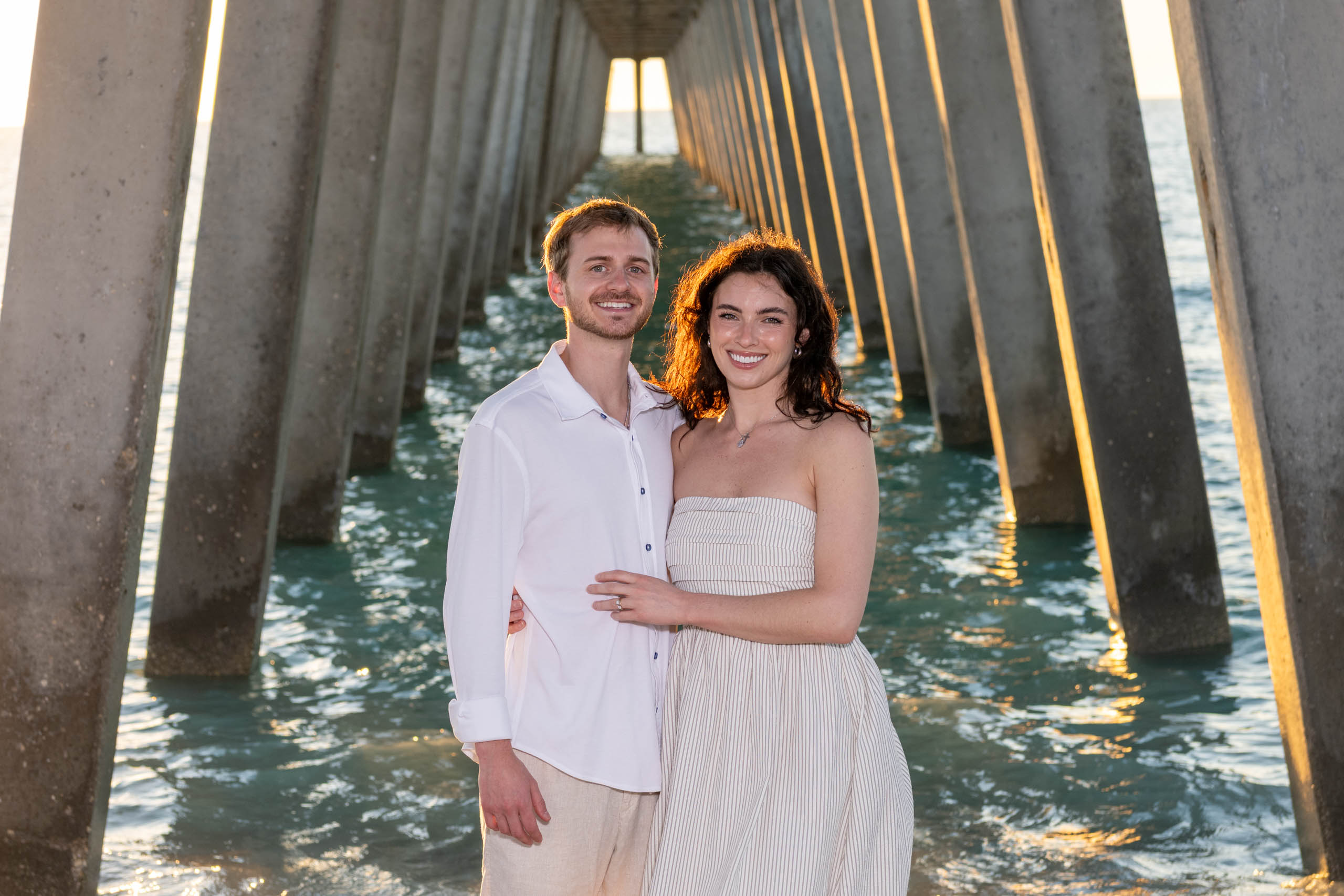 young married couple under the pier