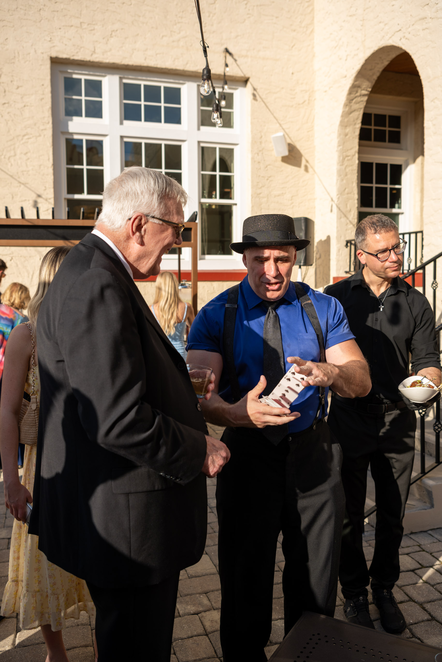 magician doing an illusion during cocktail hour