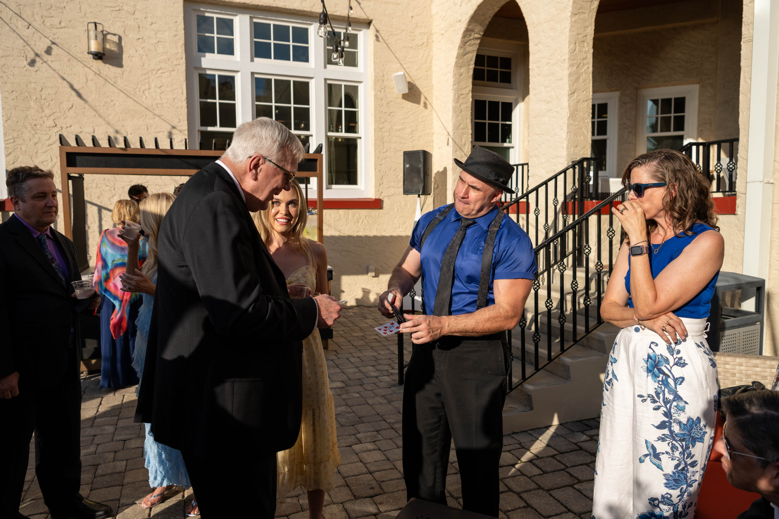 magician performing during cocktail hour at the Fenway Hotel