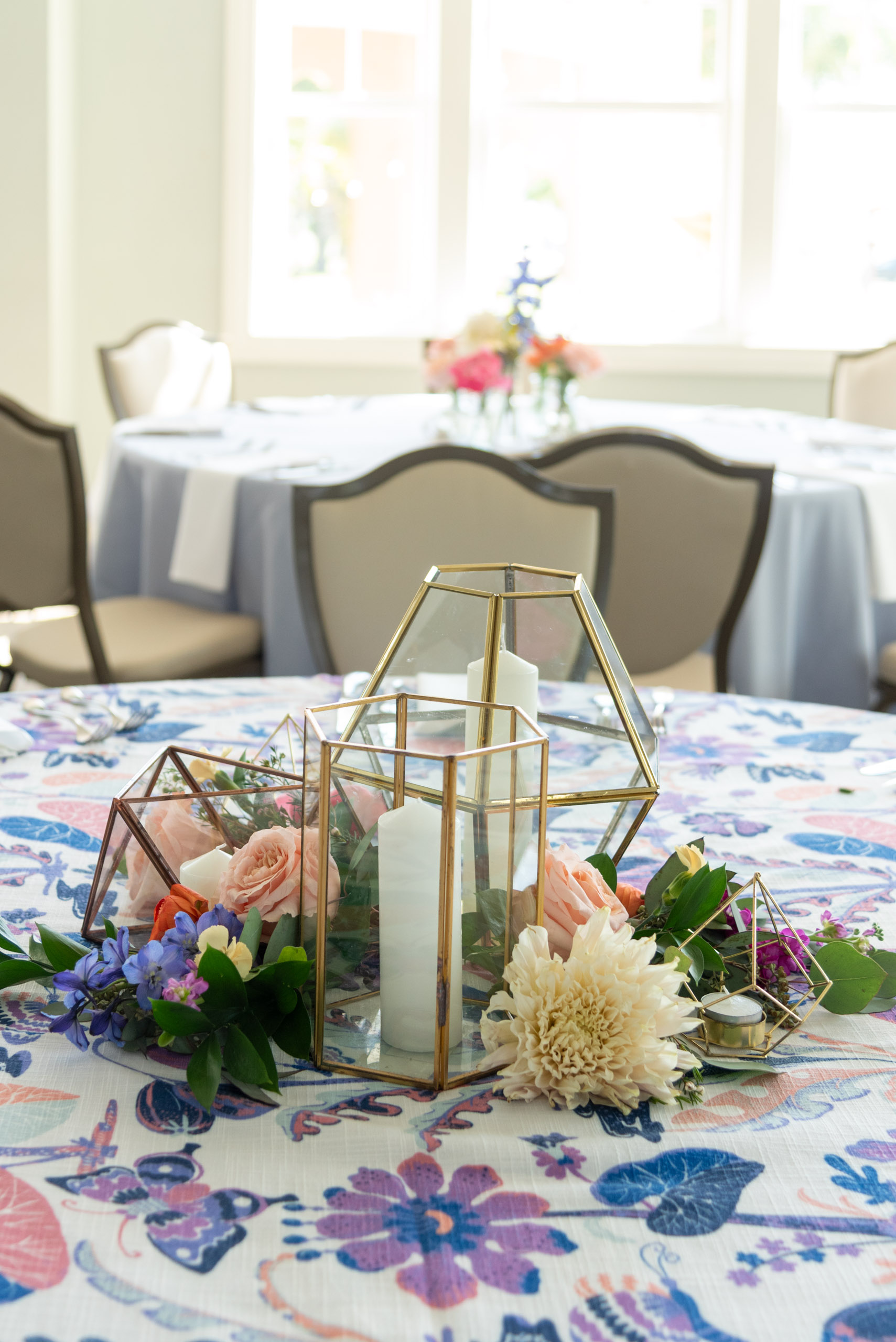 flowers and candles on the reception tables provided by Leaf it to Us