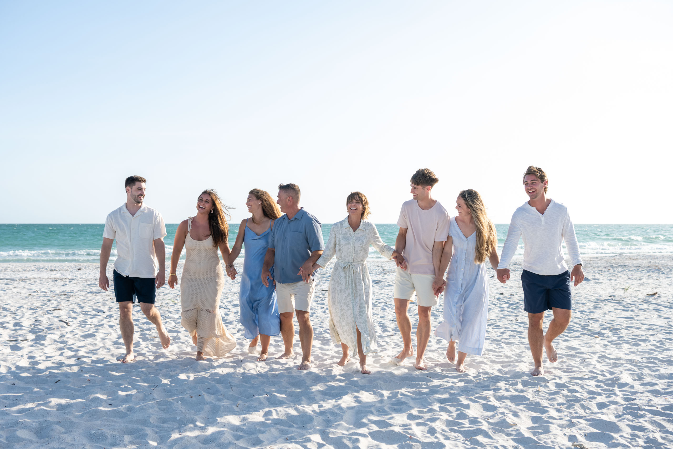 family walking on beach at Sea Oats of Boca Grande