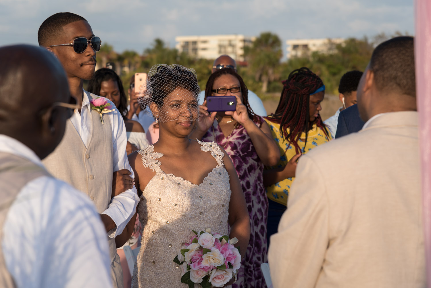bride approaches husband at altar