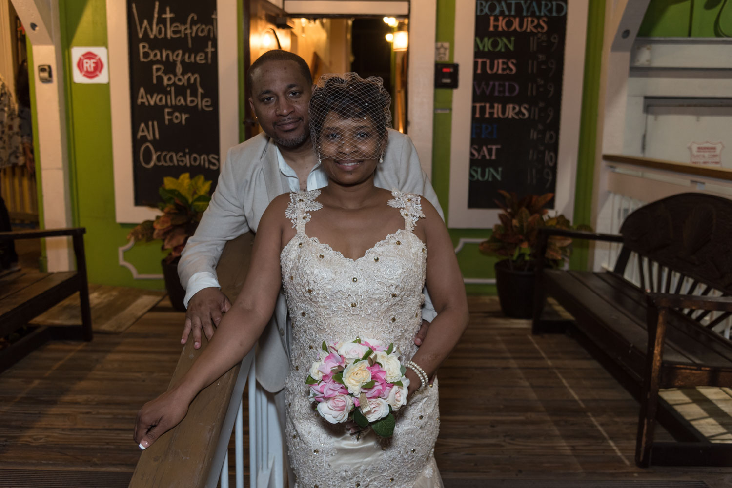 bride and groom before entering their wedding reception