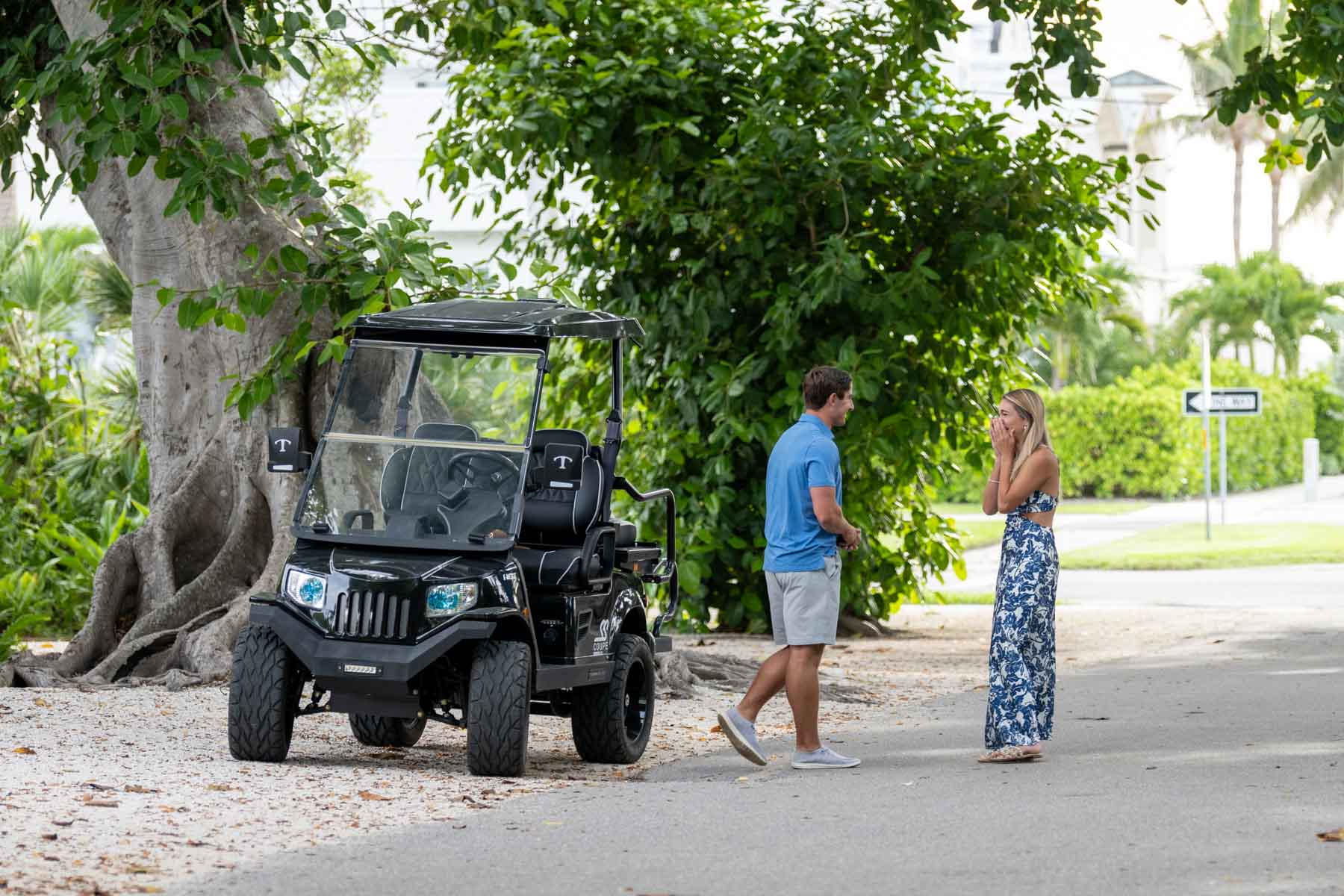 Will gets out of golf cart on Banyan Street and walks towards Hannah