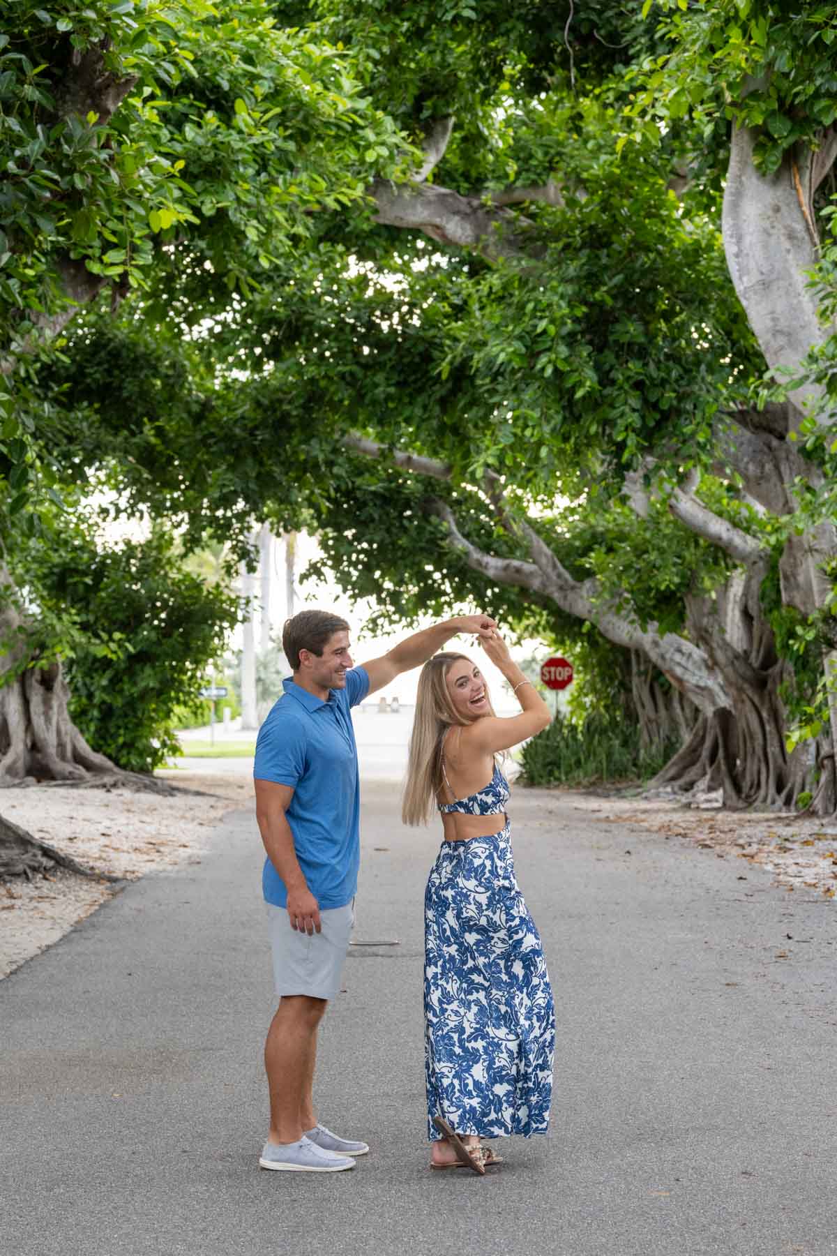 Will twirls his new fiance around as they celebrate their engagement on Banyan Street in Boca Grande
