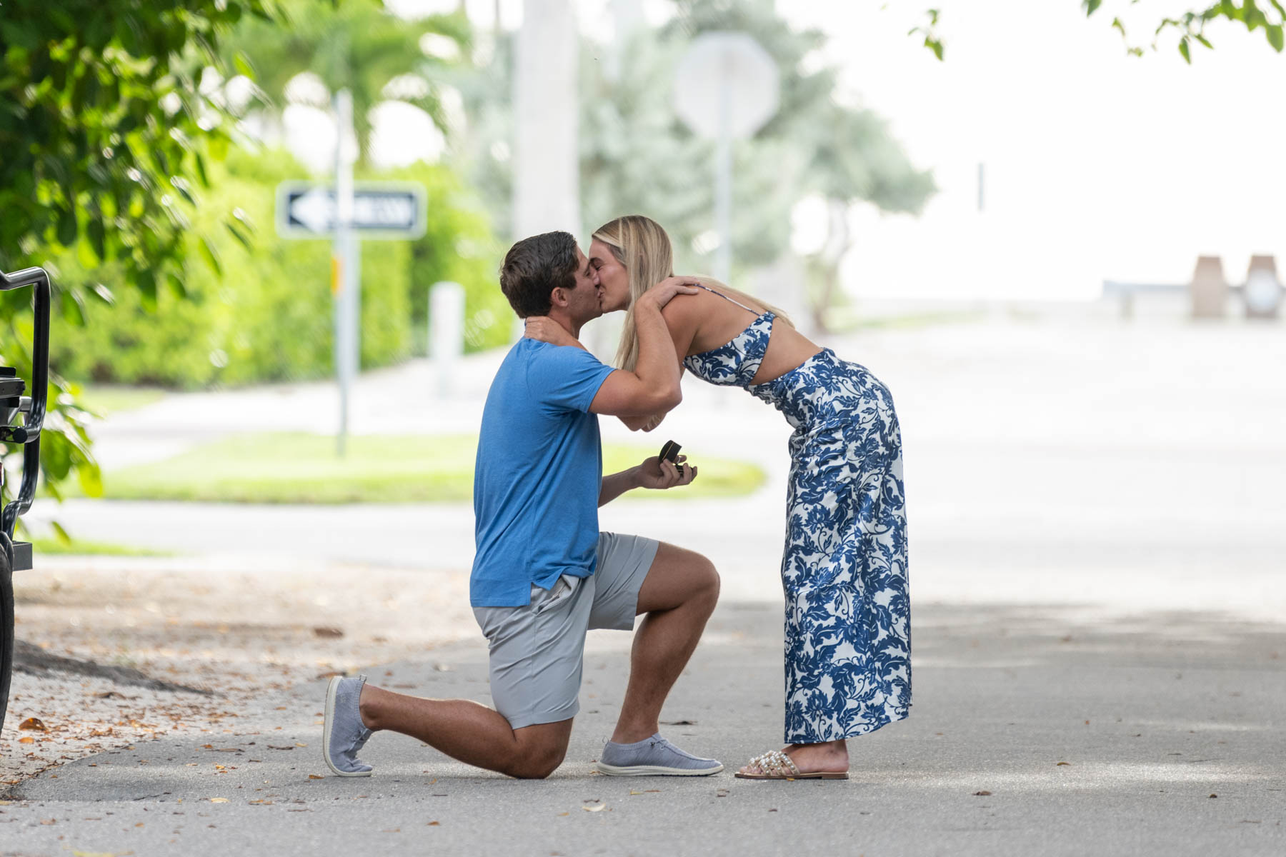 Will and Hannah kiss after his surprise proposal on Banyan Street in Boca Grande