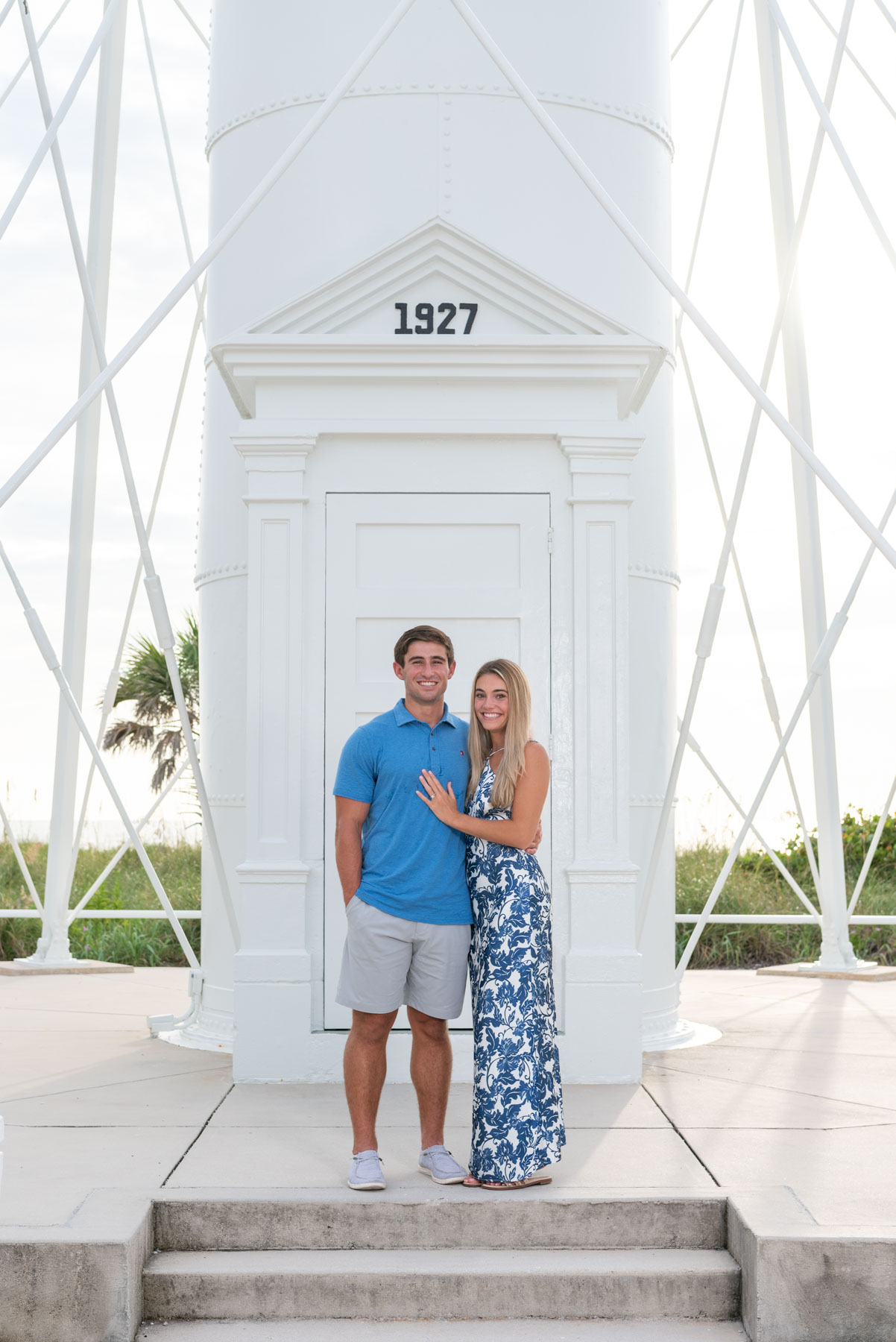 newly engaged couple in front of lighthouse on Gasparilla Island