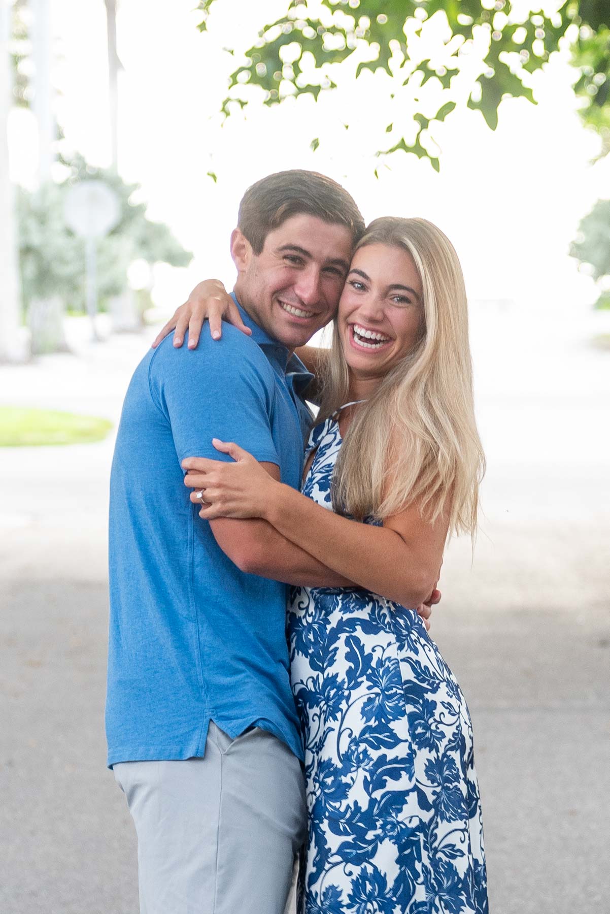 Hannah and Will smile broadly after engagement on Banyan Street