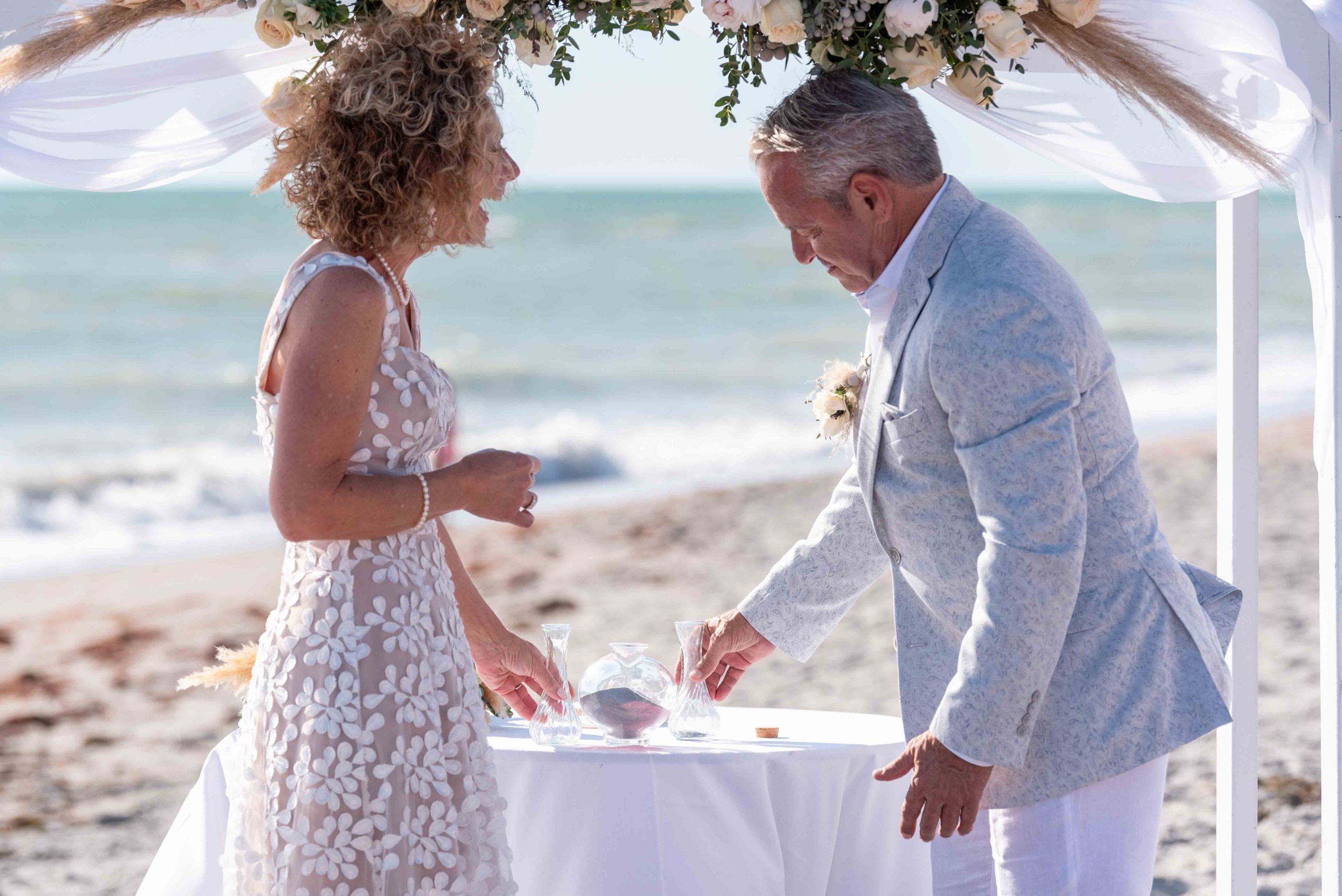 bride laughs during wedding ceremony on Englewood Beach