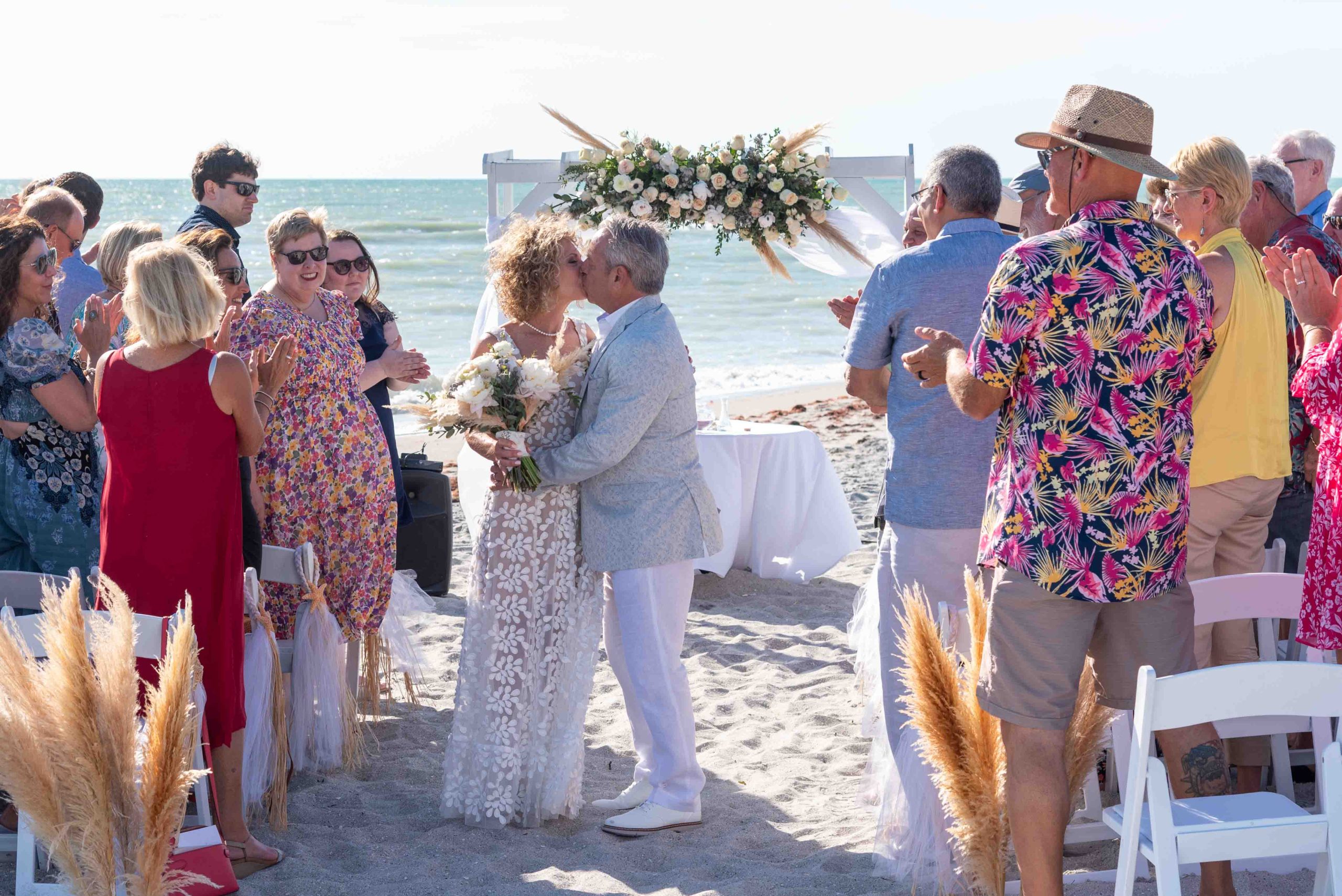 couple continue to kiss at the alter after wedding