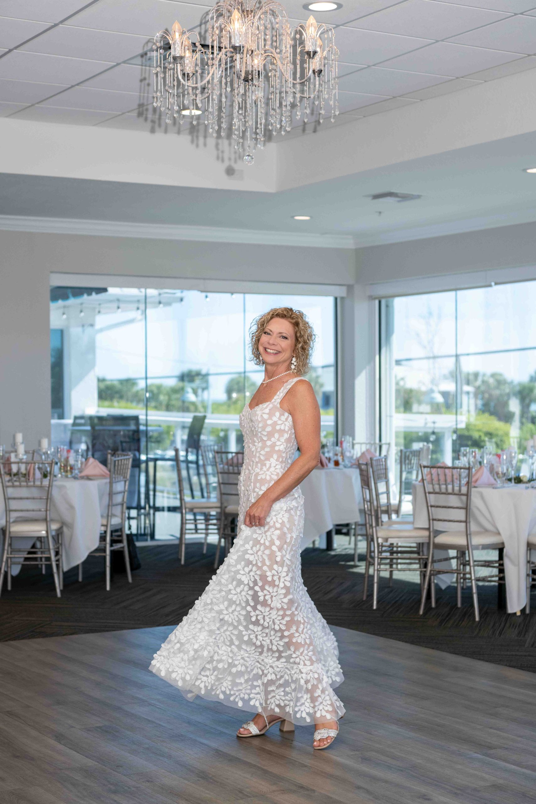 the bride dancing in the ballroom at The Waverly on Manasota Key before the wedding