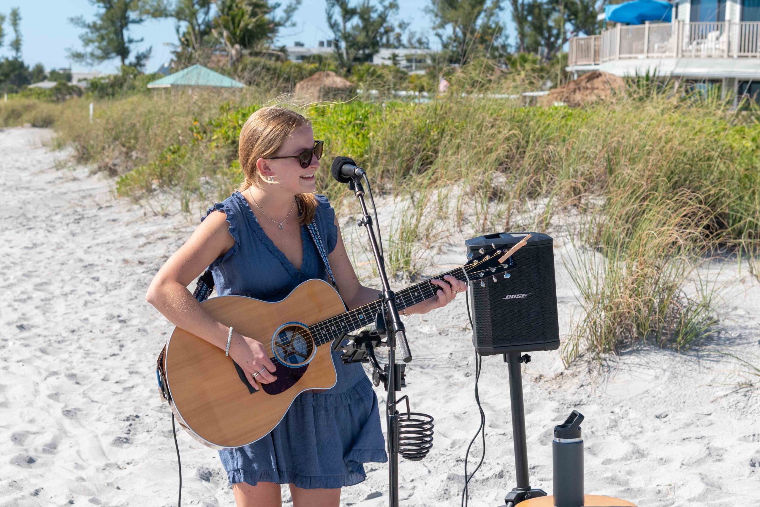 guitarist singing at the beach