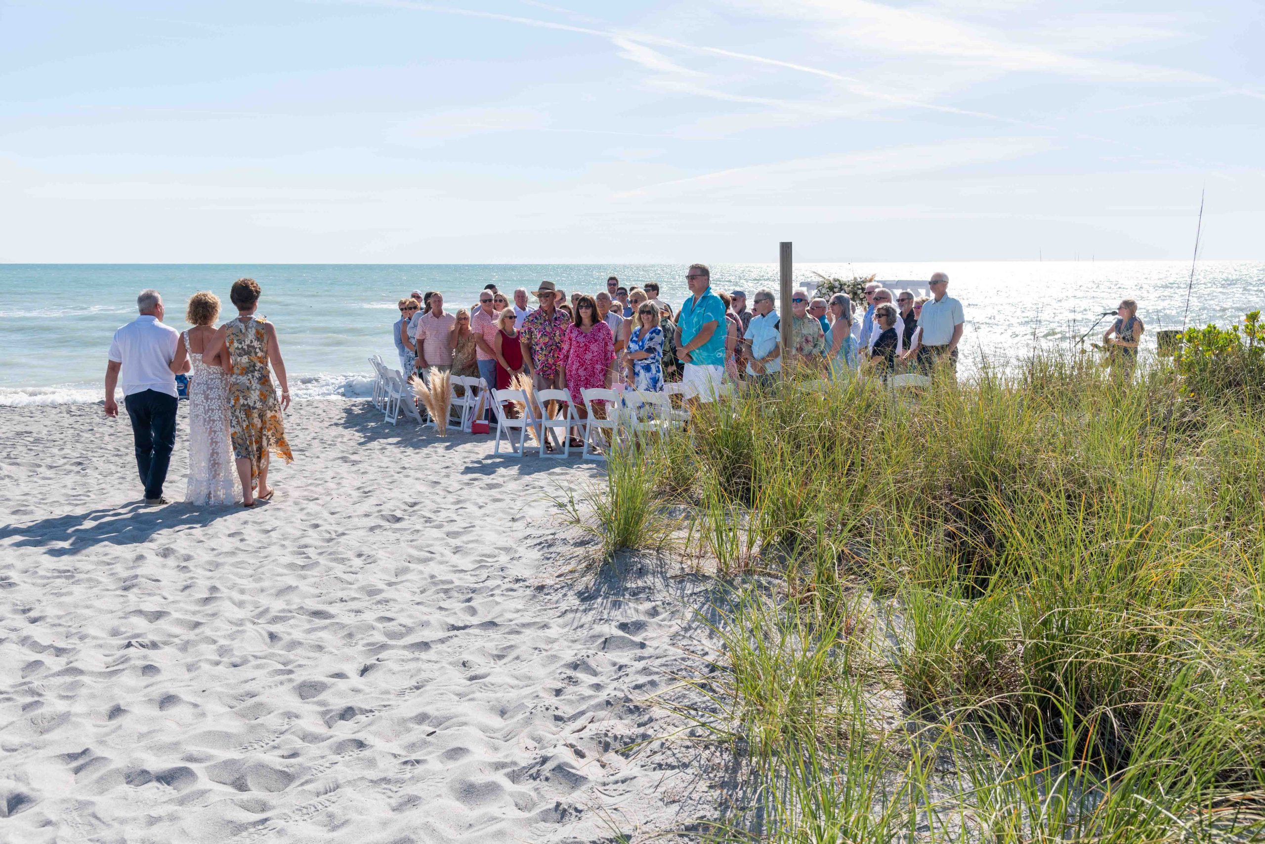 bride walking to her wedding on Engelwood Beach
