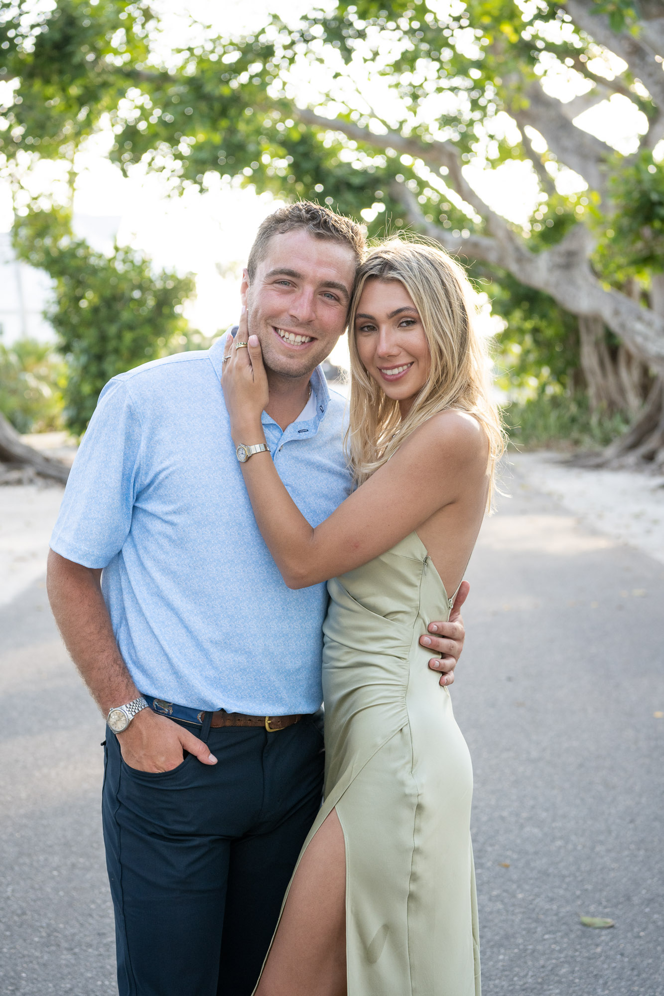 Boca Grande engagement session with couple standing together on Banyan Street