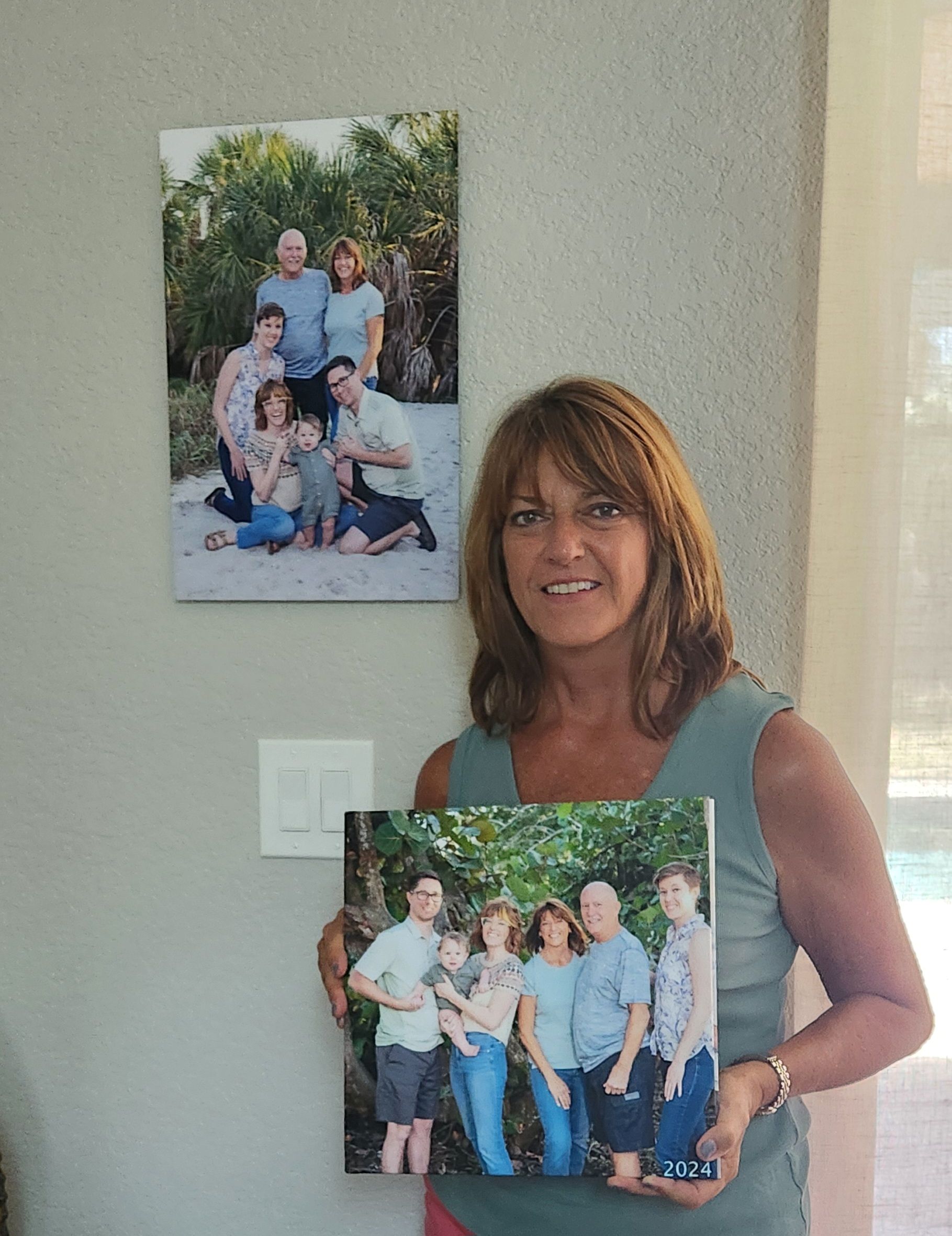 woman with album and canvas