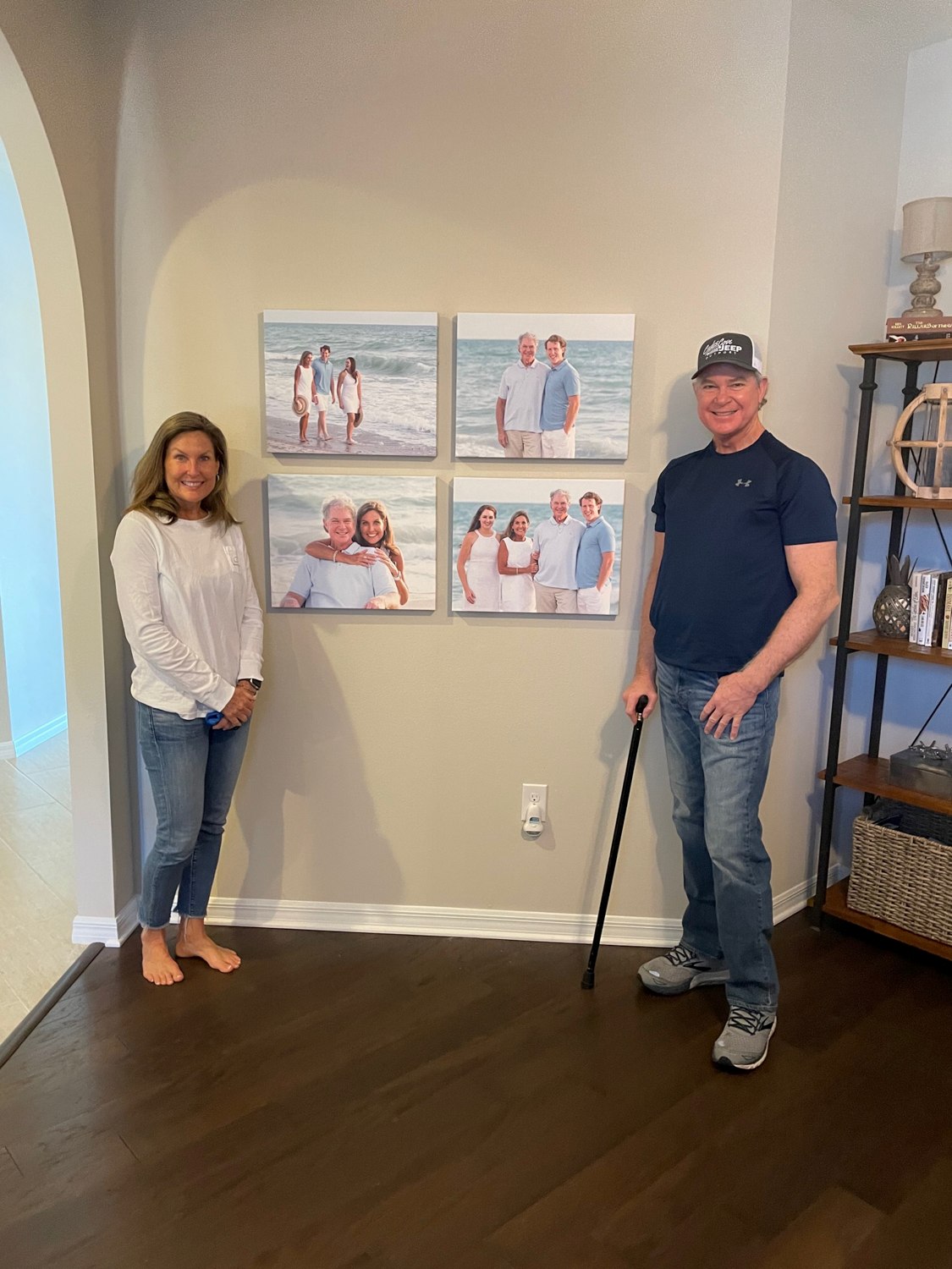 adults showing off four canvas wall pictures