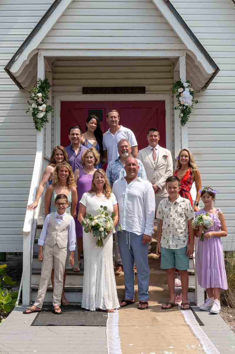family photo on the front steps of the chapel