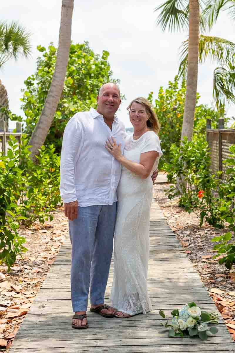 bride puts her hand on grooms chest