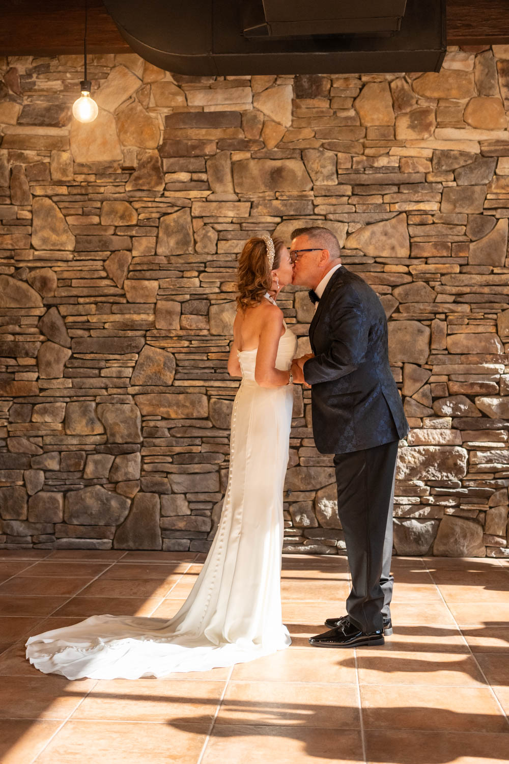 bride and groom have their first kiss as husband and wife