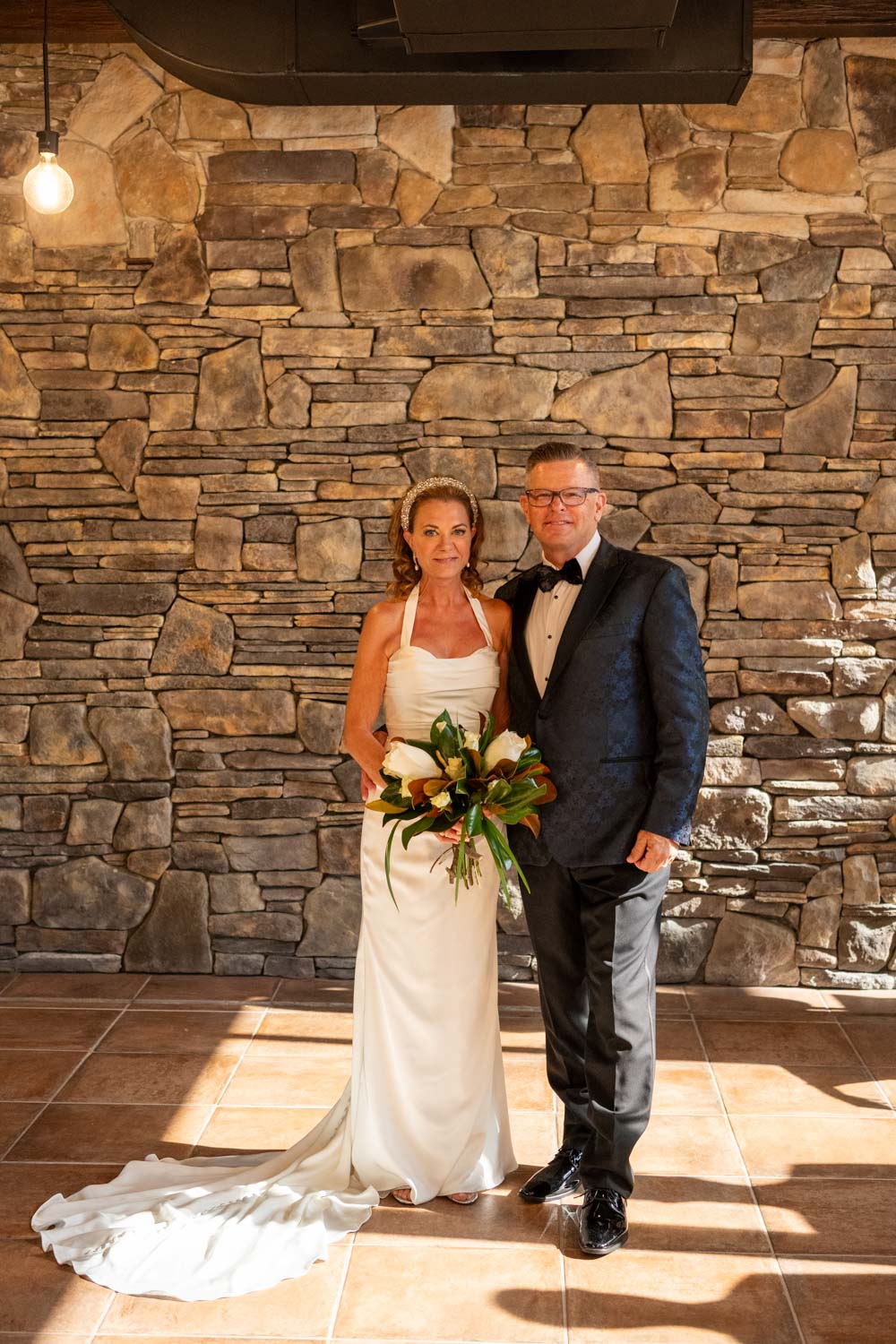newly married couple turn to look at their guests