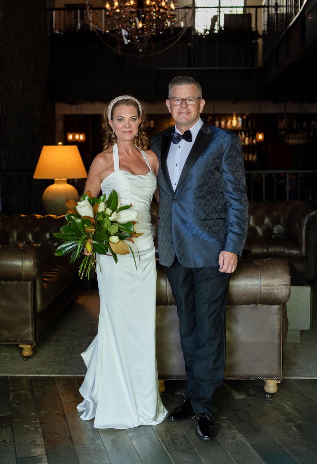 bride and groom stand together in lobby of Sage SRQ before their wedding