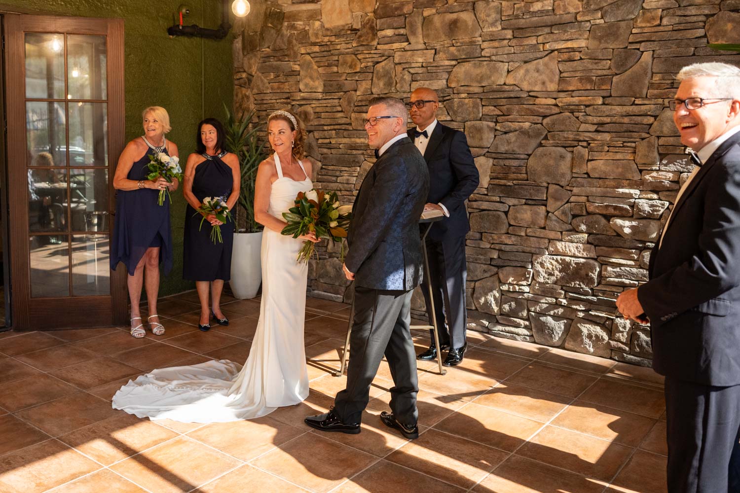 bride and groom look back at their guests