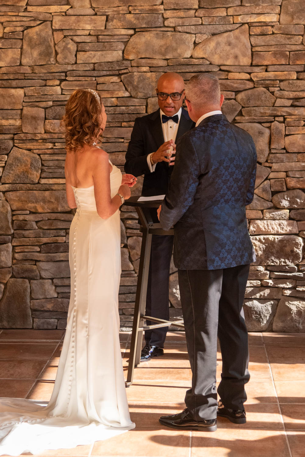 the bride, groom and officiant