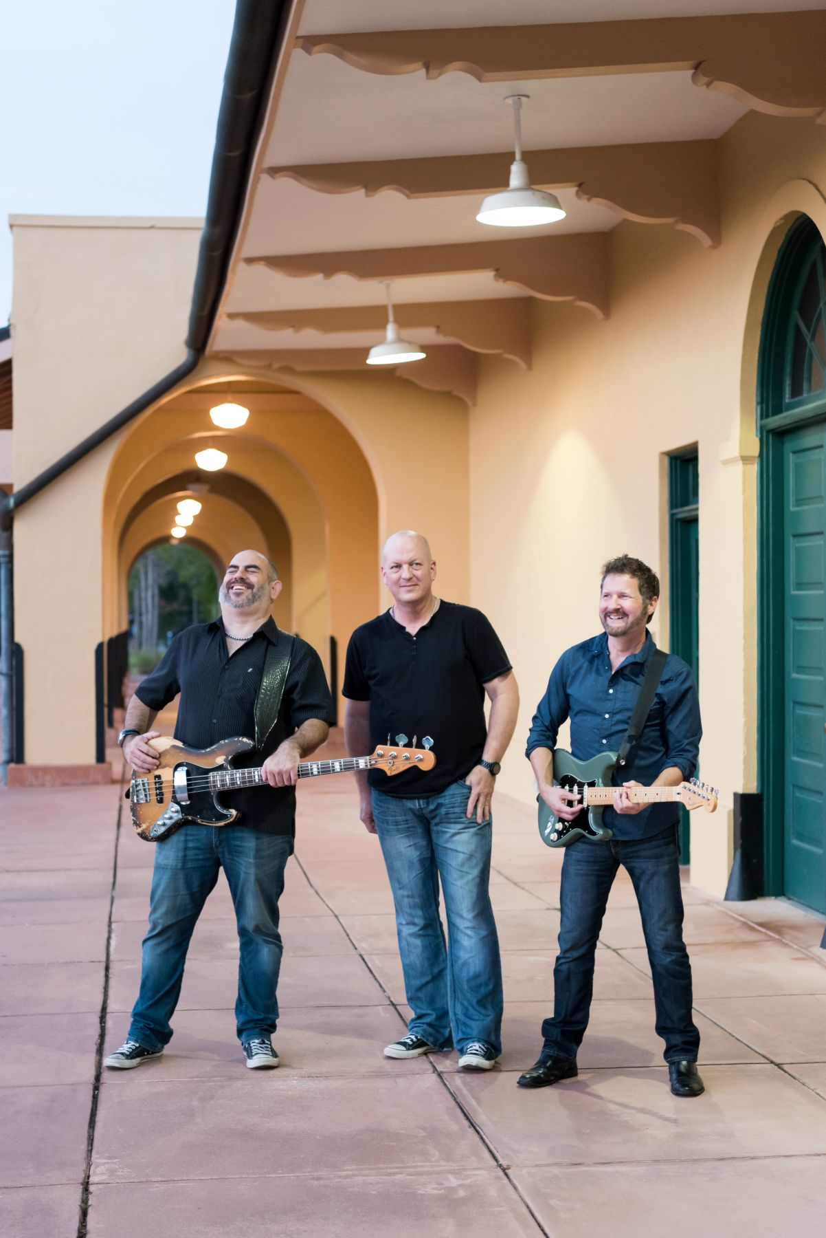 The Monsoons play their instruments as they hang out at the Venice Train Depot
