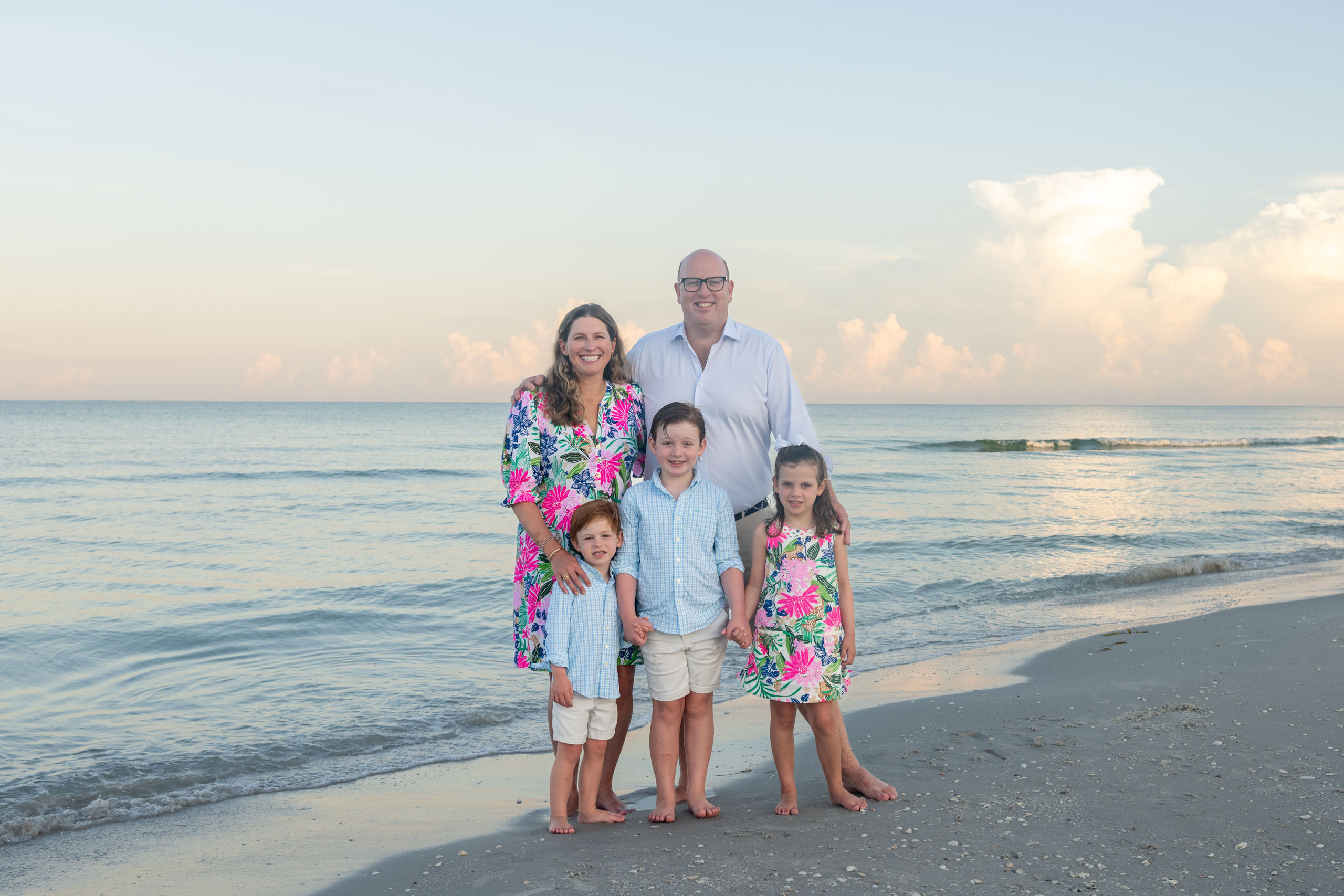 family photo on the beach at sunrise