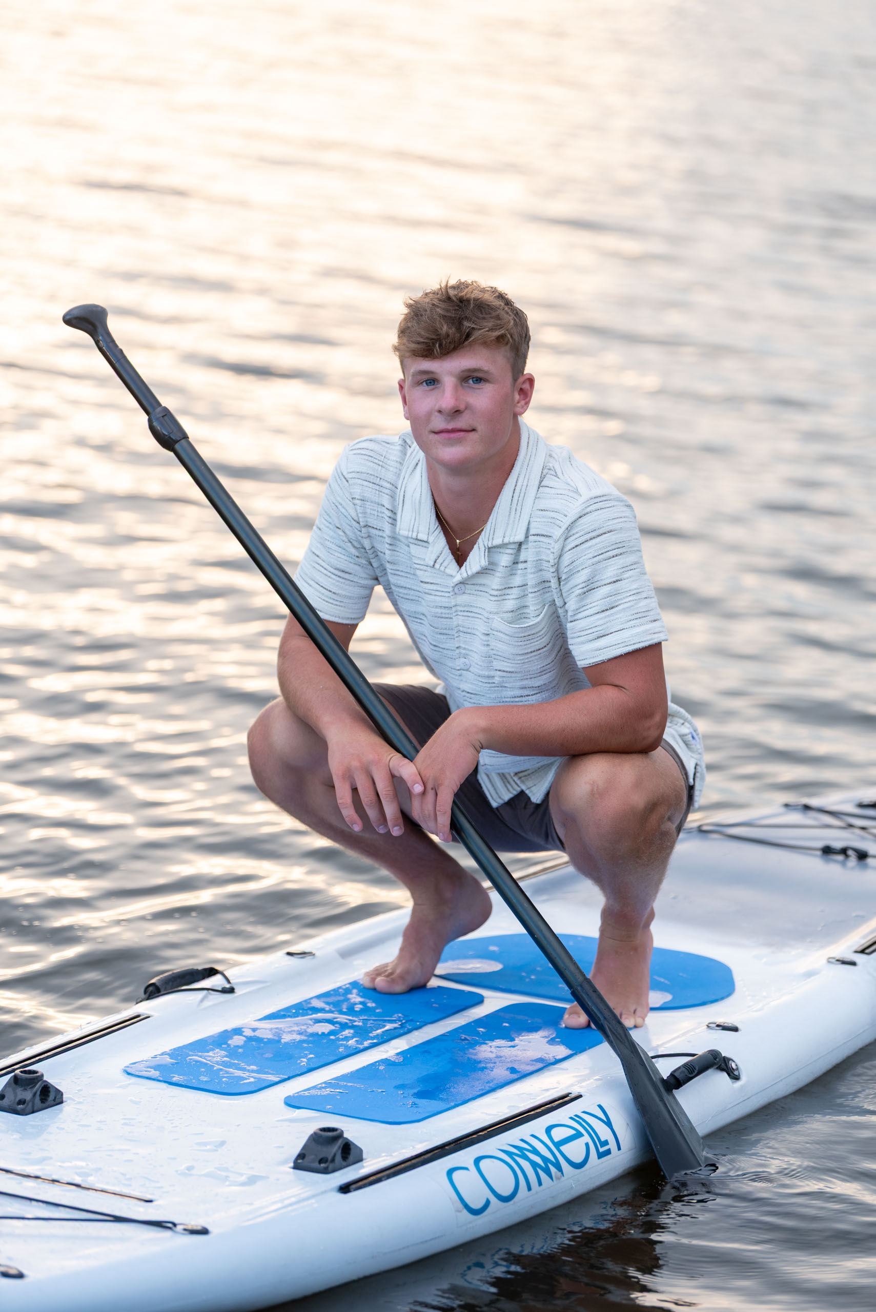 senior boy on paddleboard