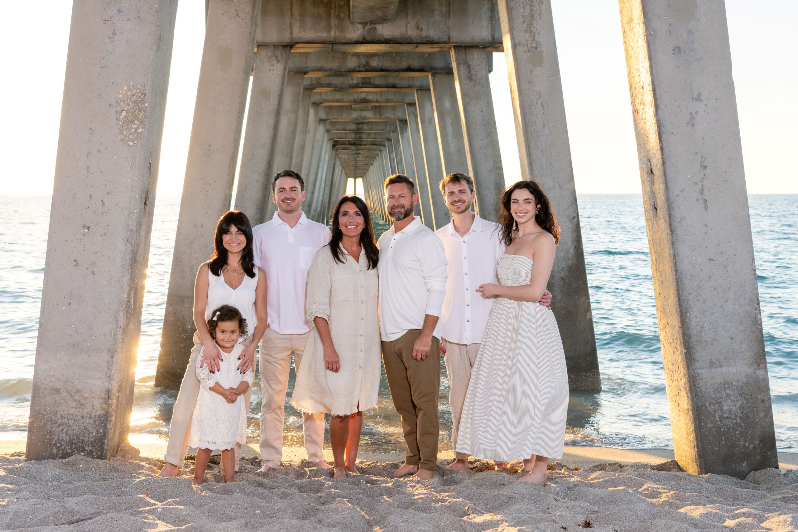 multigenerational family under the Venice Fishing Pier by Sharky's