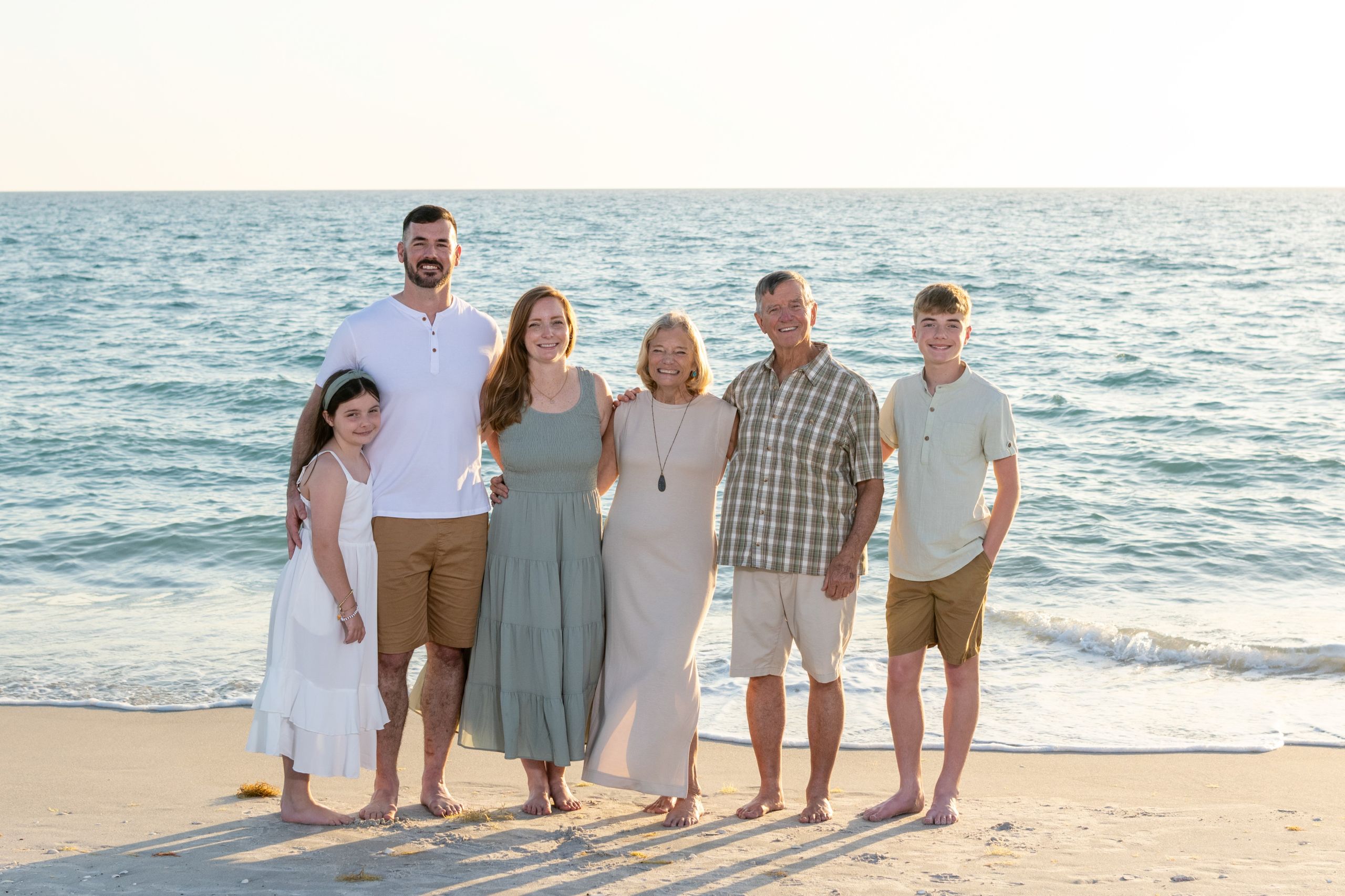 family standing together at Blind Pass Beach in Englewood