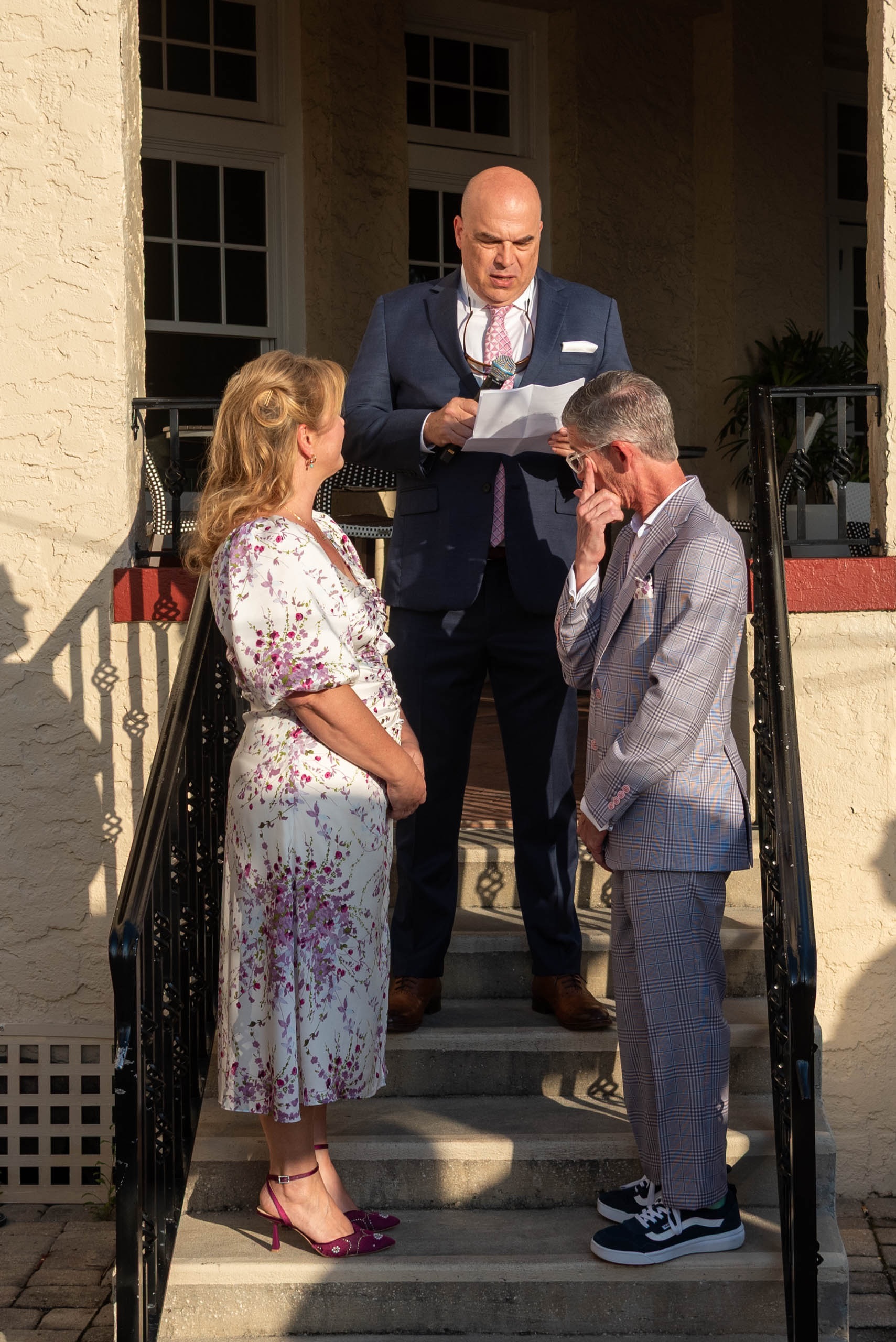 groom wipes away a tear during wedding ceremony at Fenway Hotel Dunedin wedding