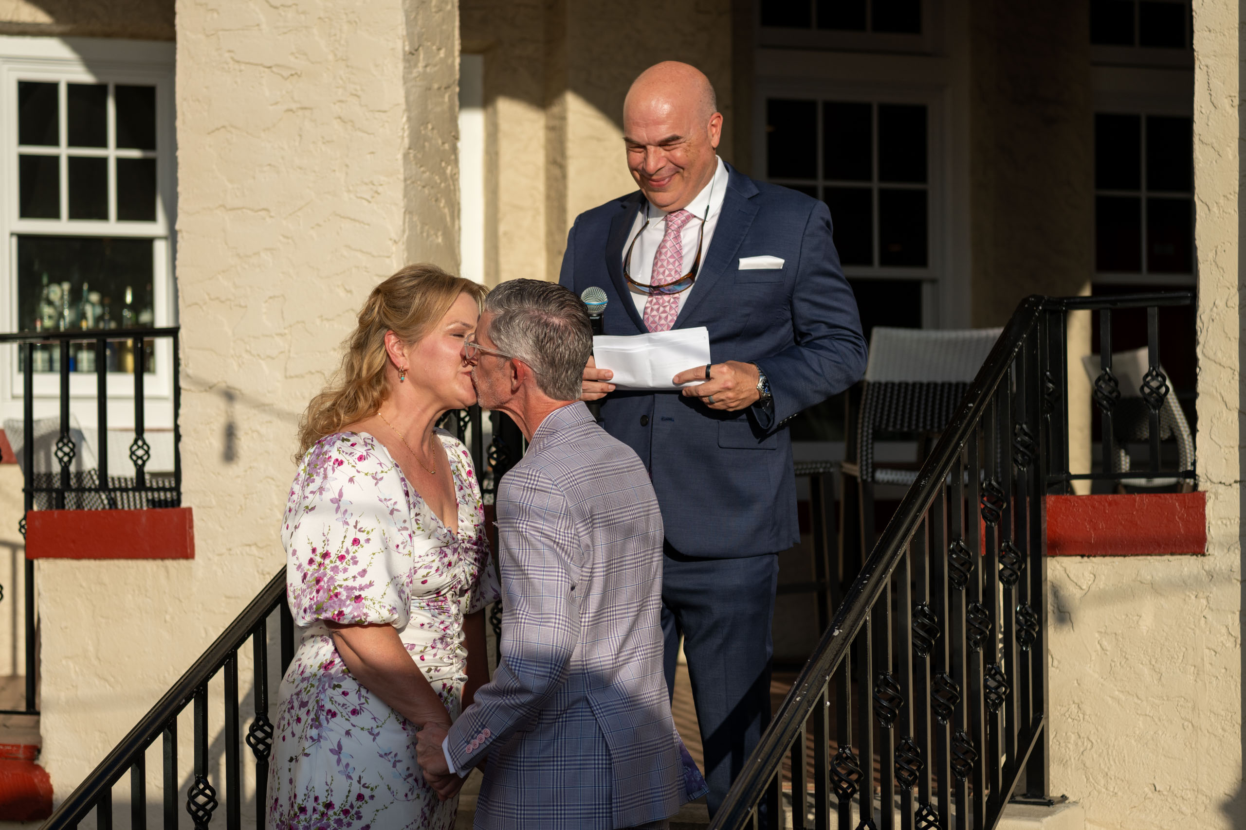 bride and groom kiss after ceremony at the Fenway Hotel Dunedin