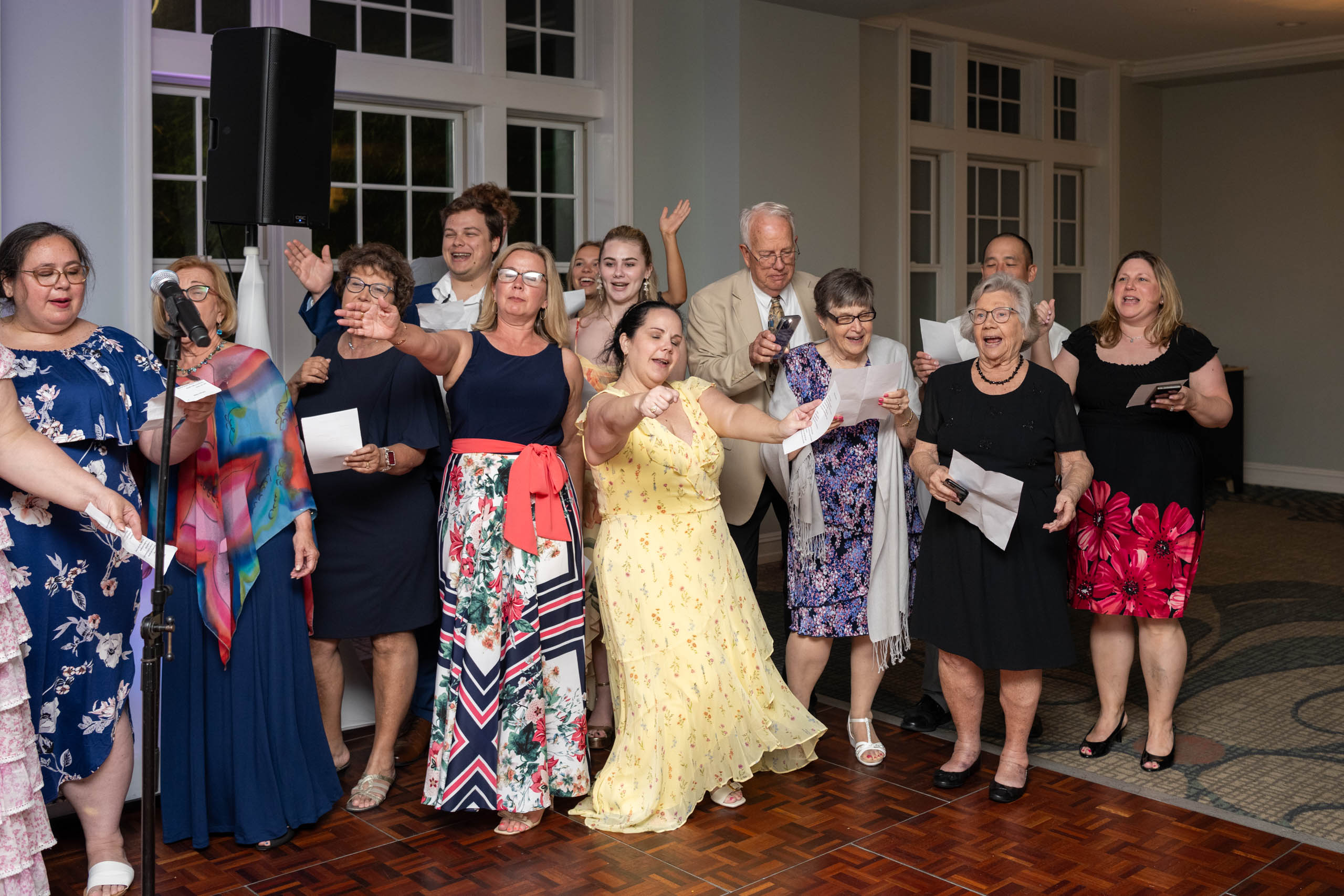 family singing a song to the bride and groom at Fenway Hotel Dunedin Florida