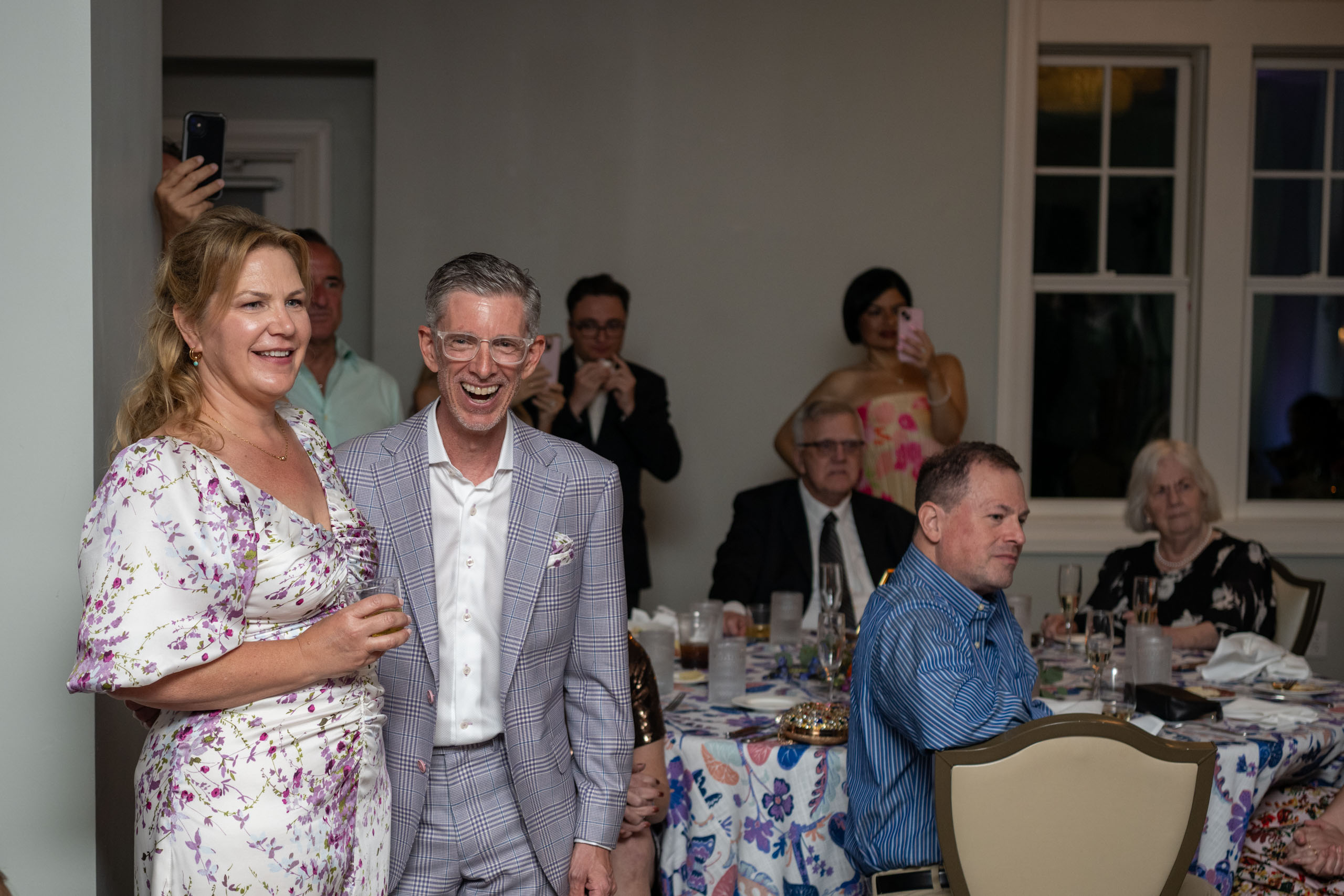 bride and groom watching the dance floor during reception