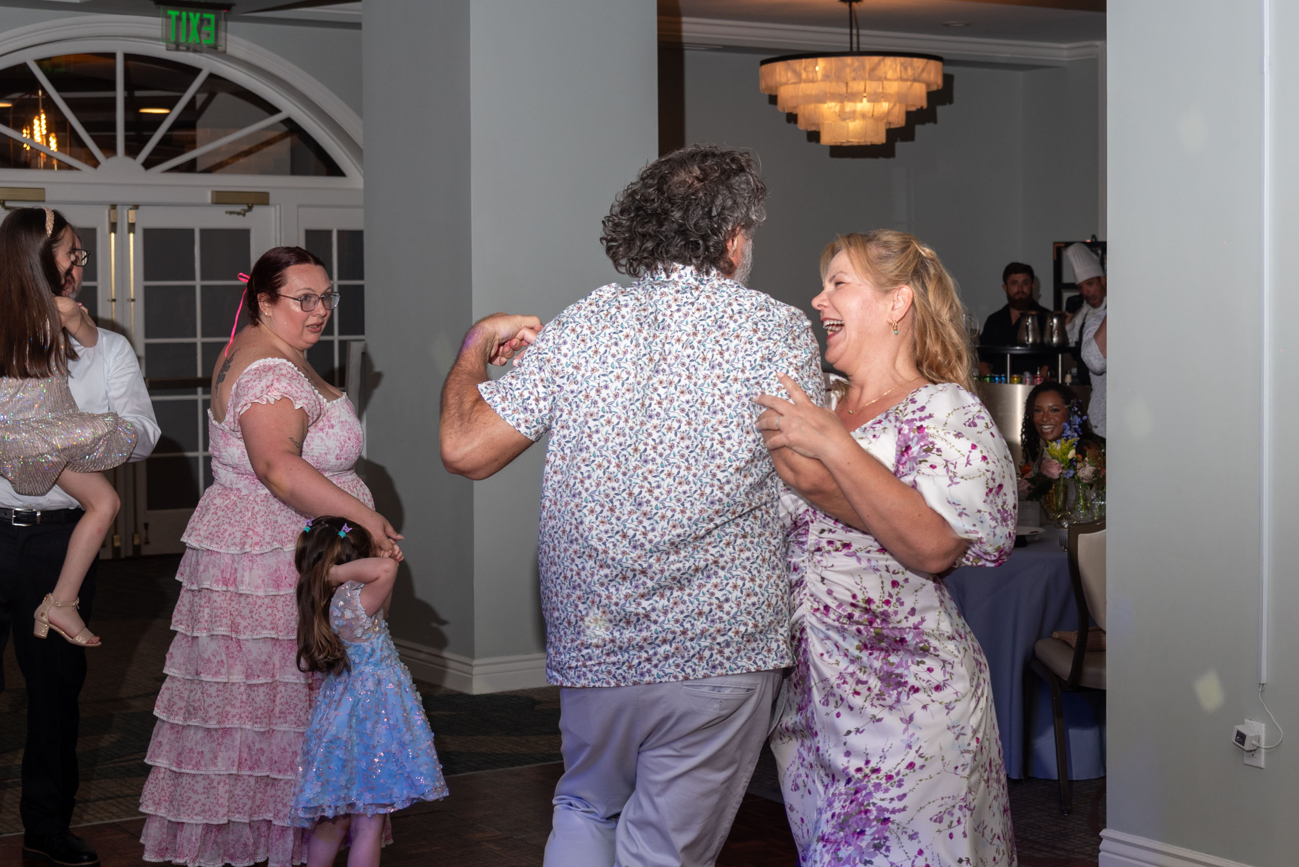 bride dancing with a guest during reception at the historic Fenway Hotel
